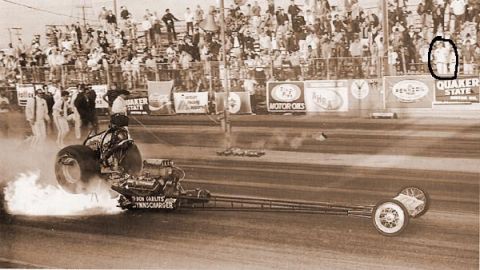 1974 Ford Ranchero - A dragster ignites its engine, producing flames as it launches down the track. Text on the vehicle reads "DON GARLITS" and "SUPERCHARGER".