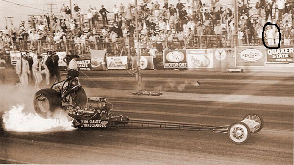 Dragster launching with flames, "DON GARLITS" and "SUPERCHARGER" visible