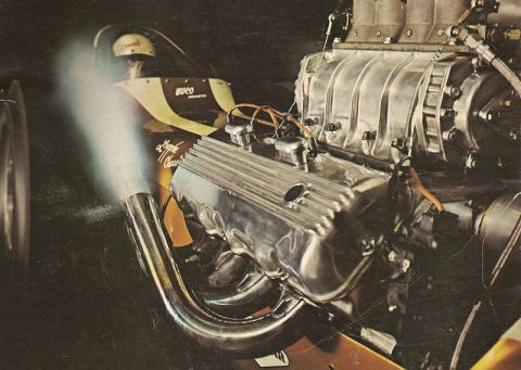1974 Ford Ranchero - Supercharged V8 engine with chrome valve covers and exhaust headers, smoke visible.
