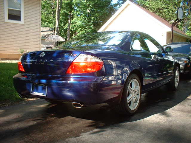 Dark blue Acura CL coupe rear three-quarter view on a driveway