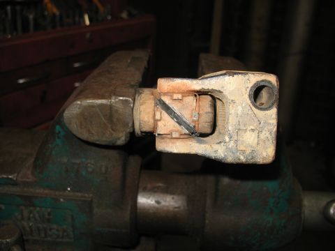 1978 Ford Bronco - Steering universal joint held in a vise, likely for repair or inspection.