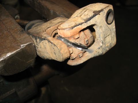 1978 Ford Bronco - Close-up of a worn steering column universal joint with a shim inserted.