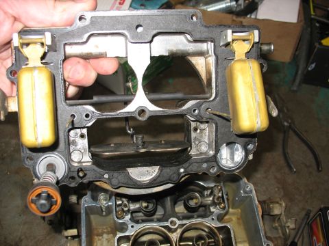 1978 Ford Bronco - A disassembled carburetor with visible floats and internal components.