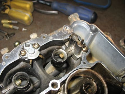 1978 Ford Bronco - Internal components of a carburetor are shown, with tools in the background.
