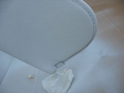 1978 Ford Bronco - A close-up view of a vehicle's sun visor, showing its textured surface and stitching detail.