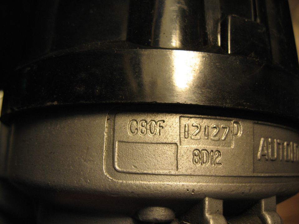 Close-up of stamped text on an automotive part: C8OF 12127D 8D12 AUTONIC