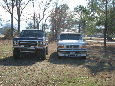 1978 Ford Bronco - Photo of a vintage Ford Bronco and a silver Ford crew-cab front view, not a technical document.