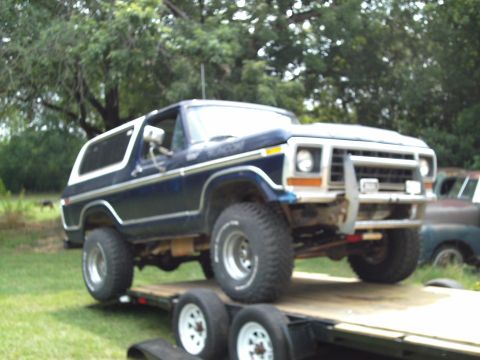 1978 Ford Bronco - A Ford Bronco is loaded onto a trailer, ready for transport or storage.