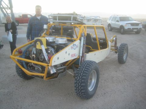 1990 Ford Bronco - Photograph of a tube-chassis off-road buggy with onlookers, not a technical document.