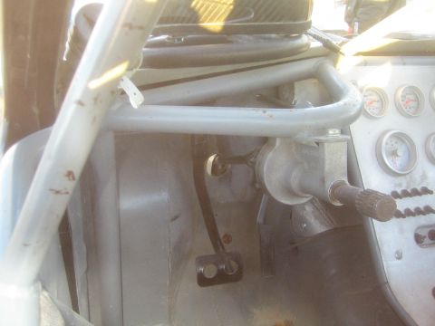 1990 Ford Bronco - Photograph of an off-road vehicle interior with steering and gauges, not a technical document.