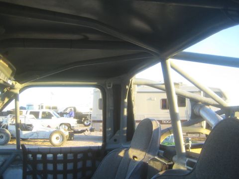 1990 Ford Bronco - Photograph from inside an off-road vehicle looking out at an RV park, not a technical document.