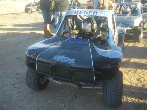 1990 Ford Bronco - Photograph of a Heger off-road race buggy at a desert event, not a technical document.