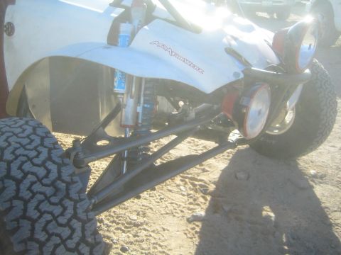 1990 Ford Bronco - Photo detailing the front suspension of an off-road race buggy, not a technical document.