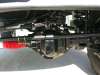 1996 Ford Bronco - Close-up underhood/undercarriage view showing wiring harnesses, connectors, and metal brackets, with a red component visible at lower left.…