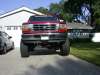 1996 Ford Bronco - Very small thumbnail of a red lifted Ford Bronco or F-Series 4x4 photographed head-on, showing the tall stance and oversized off-road tires…