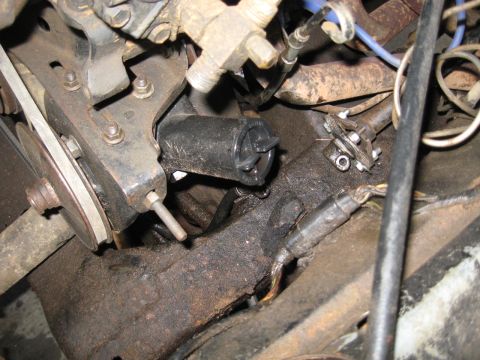1978 Ford Bronco - A detailed view of various engine components, showing mechanical parts and wiring.