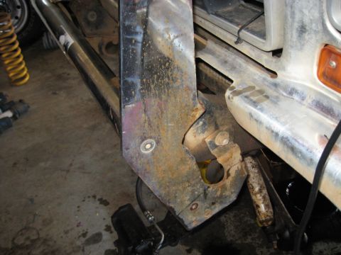 1978 Ford Bronco - Close-up of the front bumper and frame of a 1978 Ford Bronco, showing signs of wear and tear.