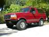 1996 Ford Bronco - Very small thumbnail of a red 1992-96 Ford Bronco shown from the driver-side rear three-quarter angle with a suspension lift and large off-…