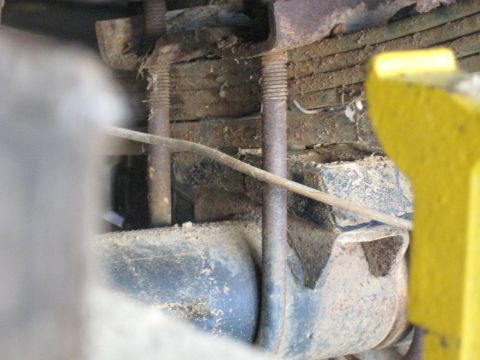 1978 Ford Bronco - This image shows the underside of a vehicle, focusing on the leaf springs and U-bolts.
