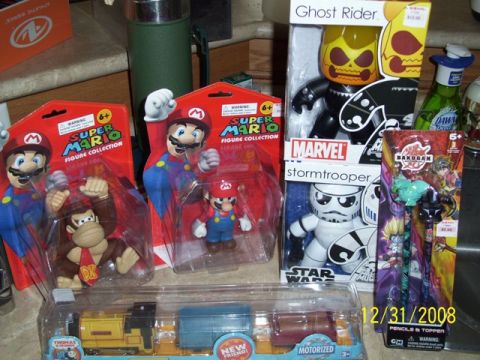 1991 Ford Bronco - A collection of popular action figures and toys are displayed, including characters from Super Mario, Star Wars, and Bakugan.