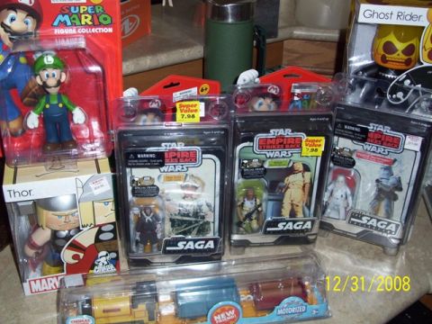 1991 Ford Bronco - A collection of toys including Star Wars figures, Super Mario figures, and a toy train, dated 12/31/2008.
