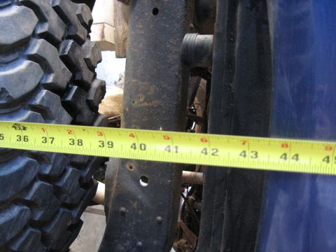 1978 Ford Bronco - A measuring tape is placed next to a tire and frame, indicating a measurement from 36 to 45 inches.