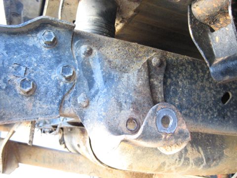 1978 Ford Bronco - This image shows a detailed view of the vehicle's suspension system, focusing on metal components and fasteners.