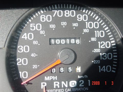 2000 Ford Crown Victoria - Speedometer and odometer reading 100186. Gear selector P R N D 2 1 is visible.