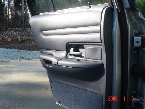 2000 Ford Crown Victoria - Interior view of a car door panel with visible text overlay from a timestamp.