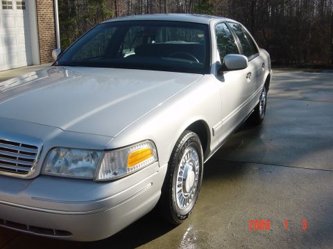 2000 Ford Crown Victoria - Front quarter view of a silver 2000 Ford Crown Victoria sedan.