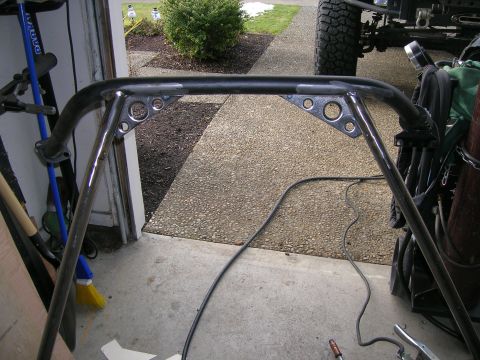 1996 Ford Bronco - Close-up view of a custom roll cage section, likely for an off-road vehicle, showing its construction details.