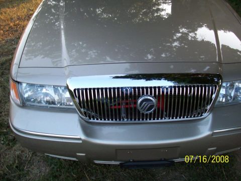 2000 Mercury Grand Marquis - Front view of a 2000 Mercury Grand Marquis, showing the chrome grille and headlights.