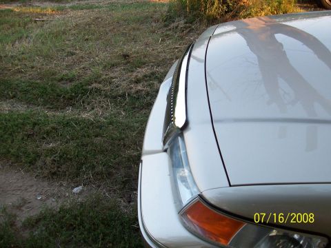 2000 Mercury Grand Marquis - The photo shows the front corner of a car, including the headlight and hood, with a date stamp in the lower right corner.