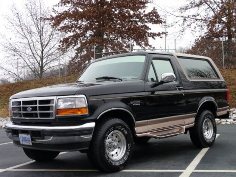 1996 Ford Bronco - This 1996 Ford Bronco features a two-tone black and tan paint scheme with chrome wheels.