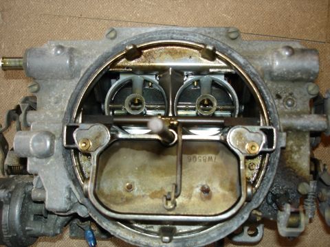 1987 Ford Crown Victoria LTD - Close-up of a carburetor, showing internal components and a part number.