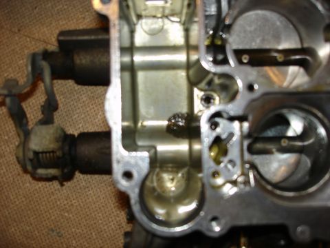 1987 Ford Crown Victoria LTD - Carburetor internals showing oil and debris, with a Supermotors.net watermark.