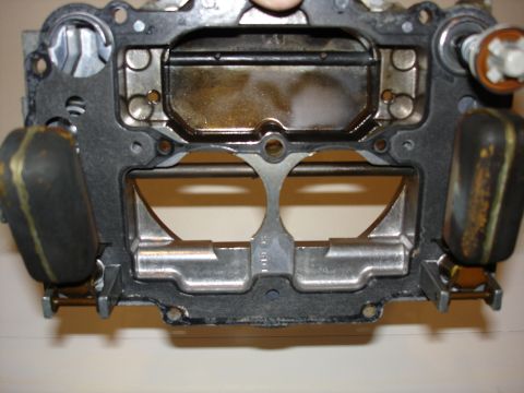 1987 Ford Crown Victoria LTD - Close-up of a carburetor part, likely from an engine rebuild project.