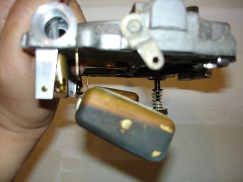 1987 Ford Crown Victoria LTD - A close-up view of a carburetor float, showing wear and discoloration.