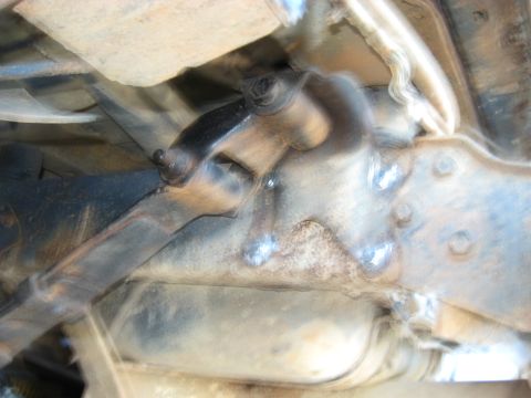 1978 Ford Bronco - Close-up view of a suspension component, likely from a lifted vehicle, showing welded repairs.