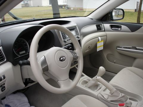 2008 Subaru Impreza - Interior view of a 2008 Subaru Impreza, the dashboard, steering wheel, and center console.