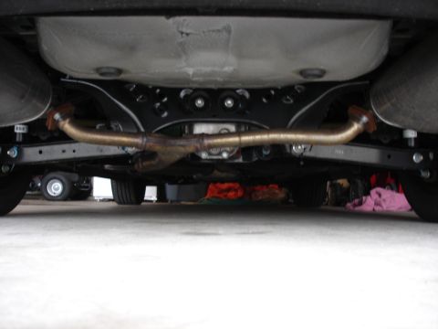 2008 Subaru Impreza - Underside view shows the exhaust pipes and rear suspension of a car.