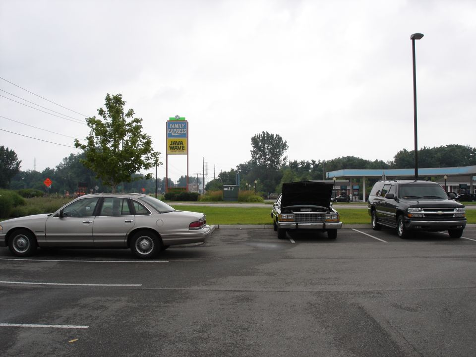 Silver 1987 Ford Crown Victoria sedan parked in a lot.