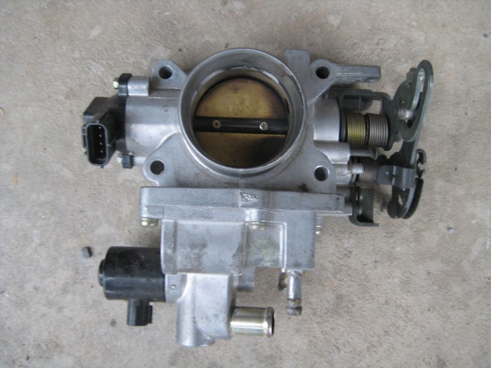 Throttle body assembly with electrical connector and springs
