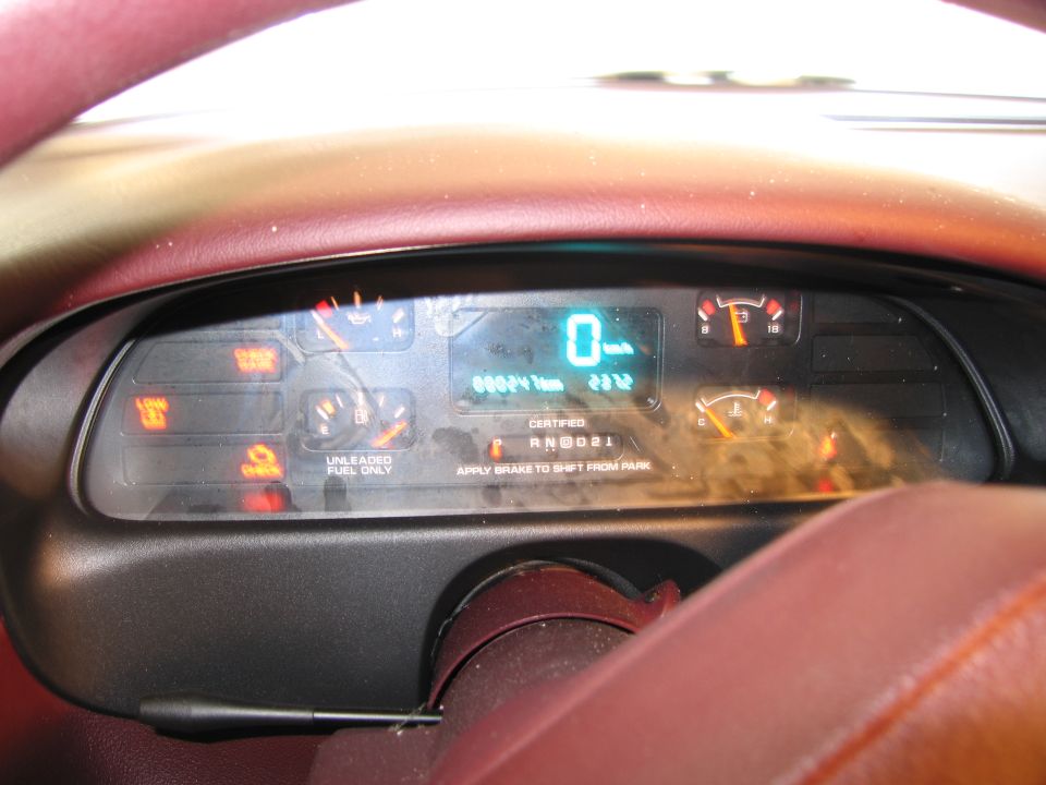 Photo of an instrument cluster behind the steering wheel