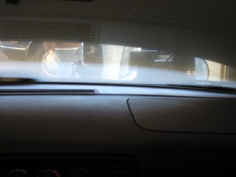 1991 Ford LTD Crown Victoria - Photograph of a vehicle dashboard and windshield, not a technical document.