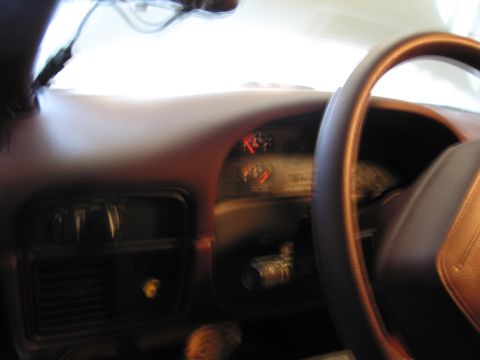 1991 Ford LTD Crown Victoria - Photograph of a vehicle dashboard and steering wheel, not a technical document.