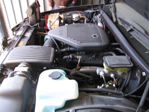 1991 Ford LTD Crown Victoria - Photograph of a vehicle engine compartment, not a technical document.