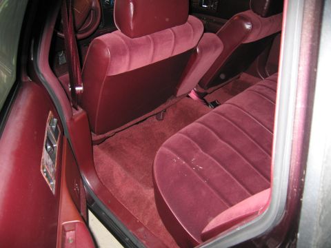 1991 Ford LTD Crown Victoria - Photograph of a vehicle rear seat, not a technical document.