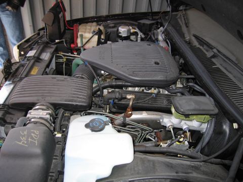 1991 Ford LTD Crown Victoria - Photograph of a vehicle engine compartment, not a technical document.