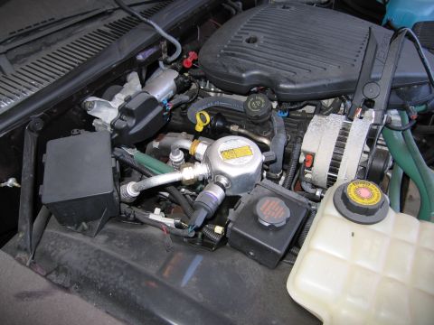 1991 Ford LTD Crown Victoria - Photograph of an engine compartment, not a technical document.